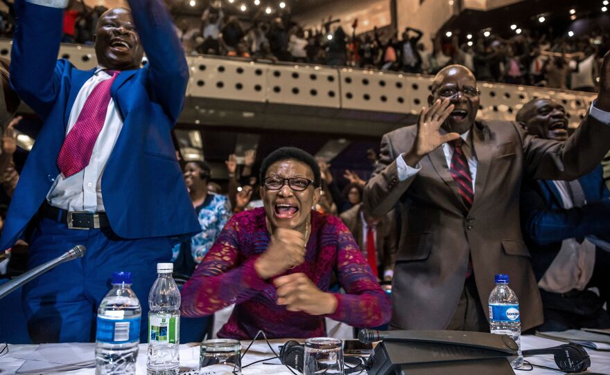 Members of Zimbabwe's parliament celebrate in Harare after Robert Mugabe's resignation on Nov. 21.