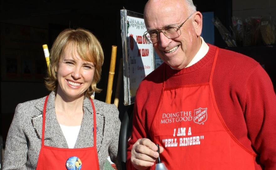 Tucson Mayor Bob Walkup poses with then-U.S. Rep. Gabrielle Giffords during a Salvation Army fundraiser about a year before she was shot in the head.