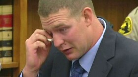 Ex-San Diego police Officer Christopher Hays wipes his eyes during his sentencing in San Diego County Superior Court, Sept. 26, 2014. 
