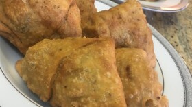 Veggie samosas stuffed with potatoes, peas and herbs are pictured in this photo. 