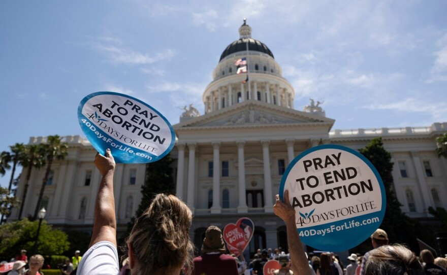 Anti-abortion protesters gathered at the state Capitol against abortion measures before the Legislature on June 22, 2022.