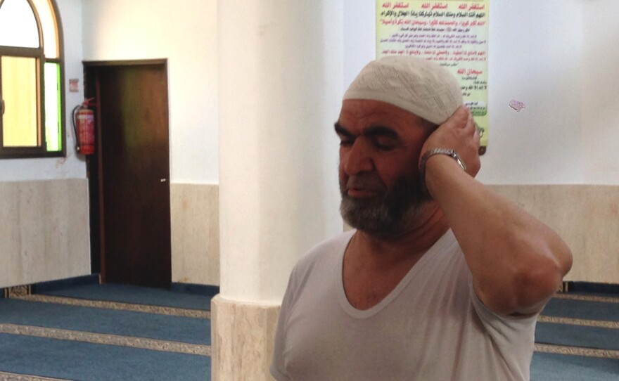 "When we go to Tel Aviv, or to the beach, we see people in different clothing, and nothing happens," says Rashid Mansur, who recites the call to prayer five times a day at a Tira mosque.