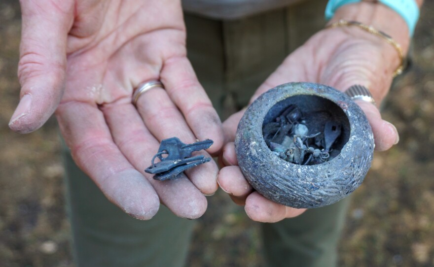 Kendall-Osborne finds a small jewelry box in the remains of her Deer Park home, one of the few recognizable items left behind.