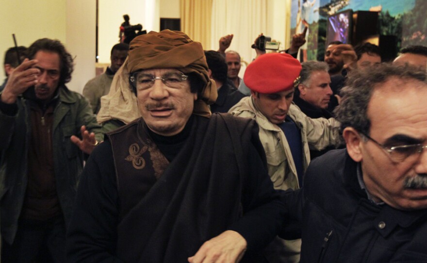 Libyan Leader Moammar Gadhafi arrives at a hotel to give television interviews in Tripoli, Libya, on Tuesday.