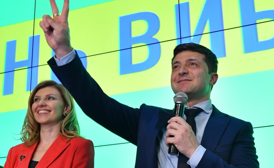 Zelenskiy and his wife, Olena, greet the crowd at his campaign headquarters in Kyiv on March 31. "He's very much a family man," Ukrainian lawmaker Sviatoslav Yurash said.