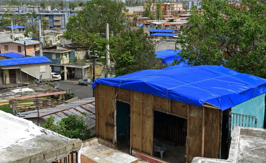 Homes in the Cantera area of San Juan, Puerto Rico are covered with FEMA tarps after Hurricane Maria. The island is now bracing for another major storm.