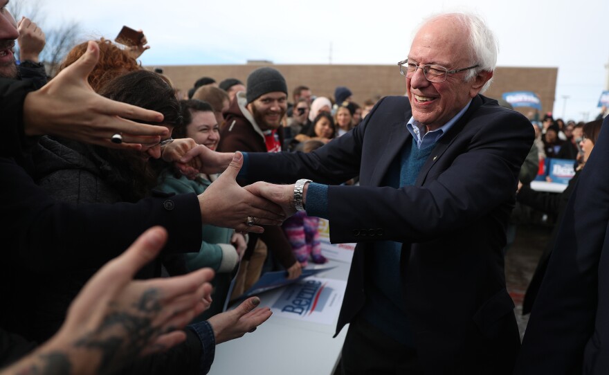 Vermont Sen. Bernie Sanders greets people at a campaign field office in Cedar Rapids, Iowa. Sanders is the slight favorite to win the caucuses, and he hopes it vaults him to the Democratic nomination.