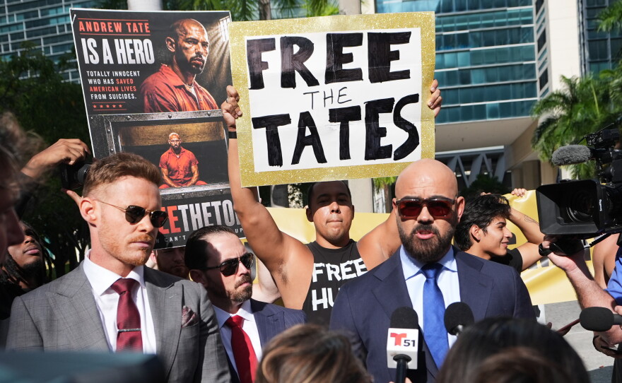Attorney Joe McBride, right, represents Andrew and Tristan Tate as they fight extradition to the U.K. on charges of rape and human trafficking. McBride spoke to the media before an Aug. 27 bond hearing in Miami.