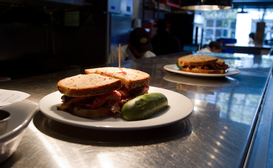 DSG's signature pastrami sandwiches and pickles.