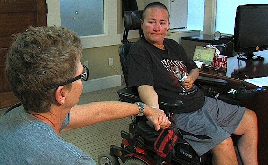 Juanita and Eurika Strotto hold hands, Oct. 26, 2015.