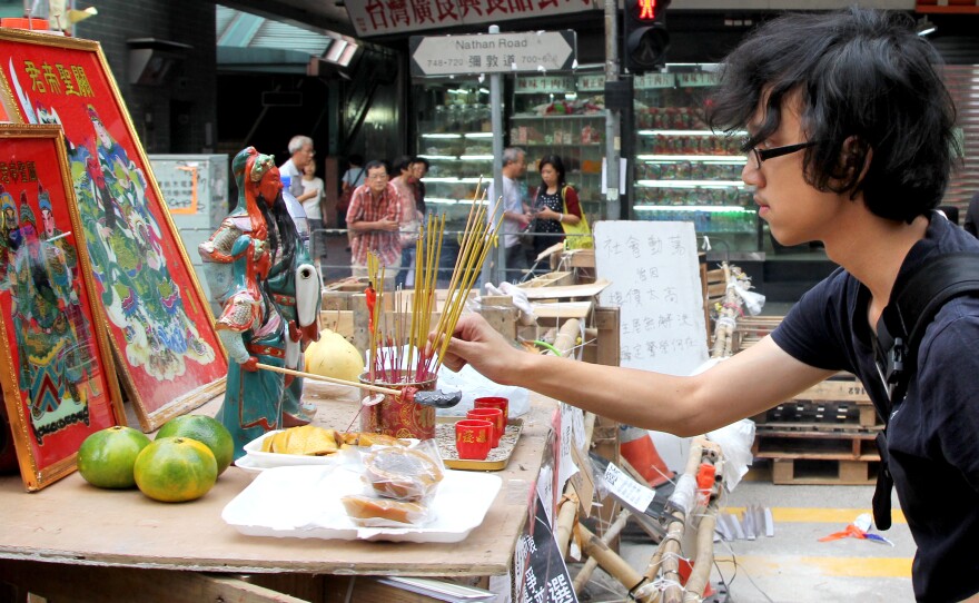 Protesters erected a shrine in Hong Kong's Mong Kok neighborhood to an ancient Chinese general to protect them from police, who fired tear gas at them last week, and gangsters, who beat them.