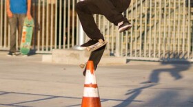  Jorge Robles shows off his skateboarding skills in front of Cherokee Point Elementary School before joining a rally for a formal skate park in City Heights.