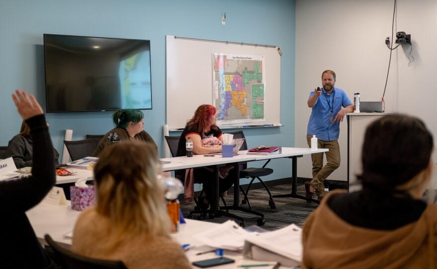 Instructor John Shryock conducts a training session at Denver 911.