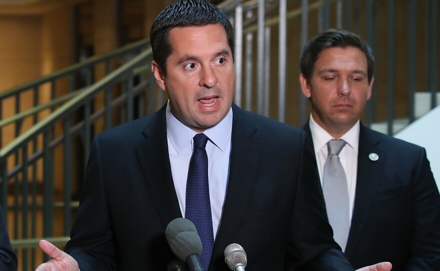 House Intelligence Committee Chairman Rep. Devin Nunes, R-Calif., speaks while flanked by and Rep. Don DeSantis, R-Fla., as he announces that his committee and the House Oversight Committee.