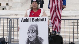 Micki Witthoeft, center, mother of Ashli Babbitt, the woman fatally shot by police inside the U.S. Capitol during the Jan. 6, 2021, riot, joins protesters outside of the Supreme Court on the second anniversary of the Jan. 6, assault on the U.S. Capitol, in Washington, Friday, Jan. 6, 2023.