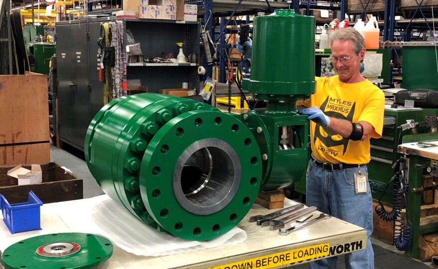 A worker assembles an industrial valve at Emerson Electric Co.'s factory in Marshalltown, Iowa. The manufacturing sector has seen a slowdown amid the ongoing trade war.