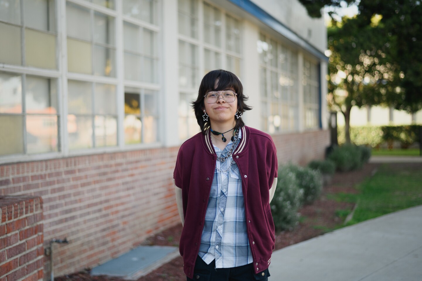 Chula Vista High student Quinton Rivera, a junior in the theater program, stands for a portrait outside the school on Jan. 30, 2024. Students say recent decisions by the district is placing the future of the school's arts program in jeopardy.