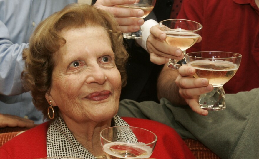 Maria Altmann celebrates with family members in 2006 after an Austrian arbitration court determined the country is legally obligated to return the Gustav Klimt paintings to her.