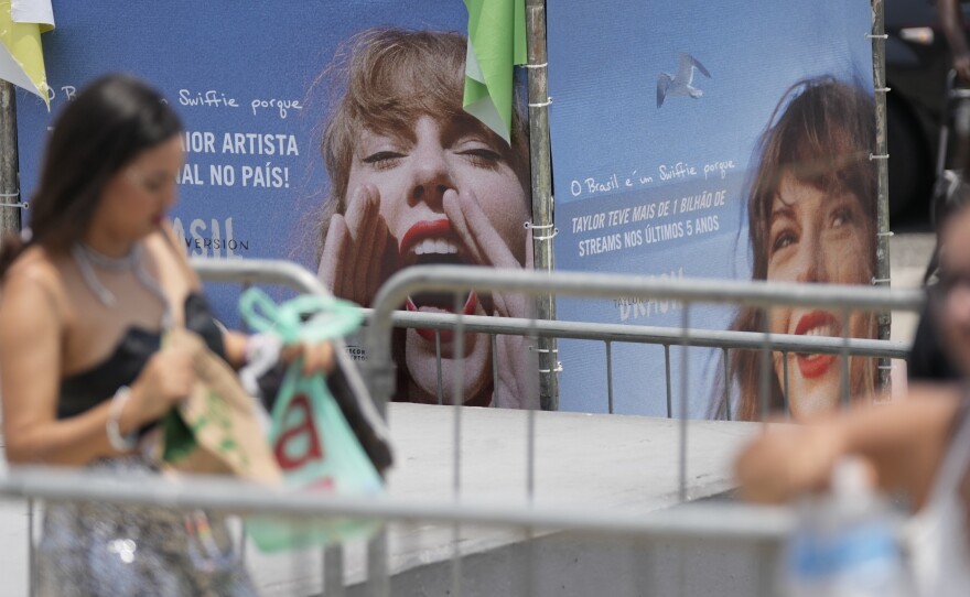Taylor Swift fans wait for the doors of Nilton Santos Olympic stadium to open for her Eras Tour concert amid a heat wave in Rio de Janeiro, Brazil, Saturday, Nov. 18, 2023.