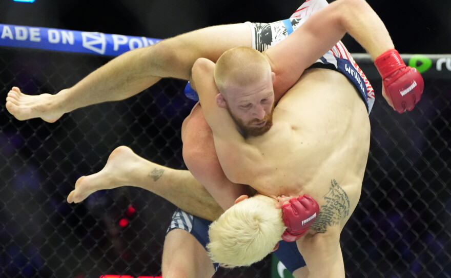 Bo Nickal, top, fights against Kyle Daukaus during their middleweight bout at UFC Freedom 250 on the South Lawn of the White House, Sunday, June 14, 2026, in Washington.