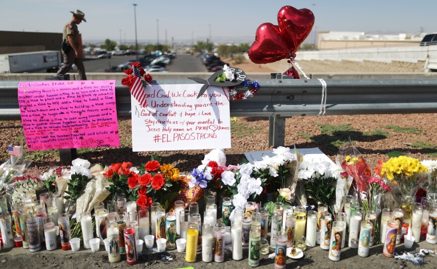 A makeshift memorial is set up outside Walmart, near the scene of Saturday's mass shooting in El Paso, Texas. Lawmakers in some states have passed what are known as "red flag" laws to prevent such shootings.