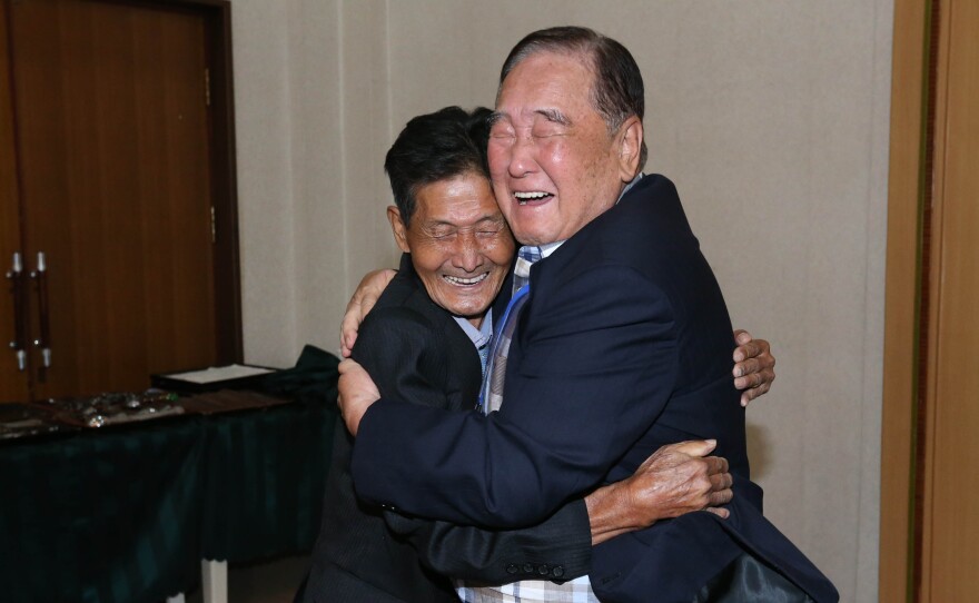 Ham Sung-chan, 93, (right) of South Korea hugs his North Korean brother Ham Dong Chan, 79, during a family reunion meeting at the Mount Kumgang resort on the North's southeastern coast.