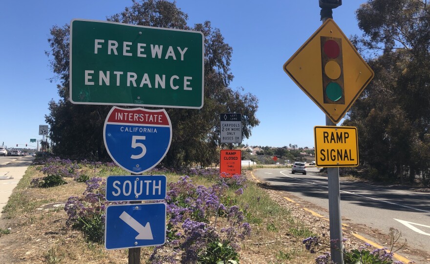 A car drives onto the onramp for the I-5 south at the Palomar Airport Road exit, March 23, 2022.