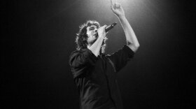 Josh Groban performing live on stage. 