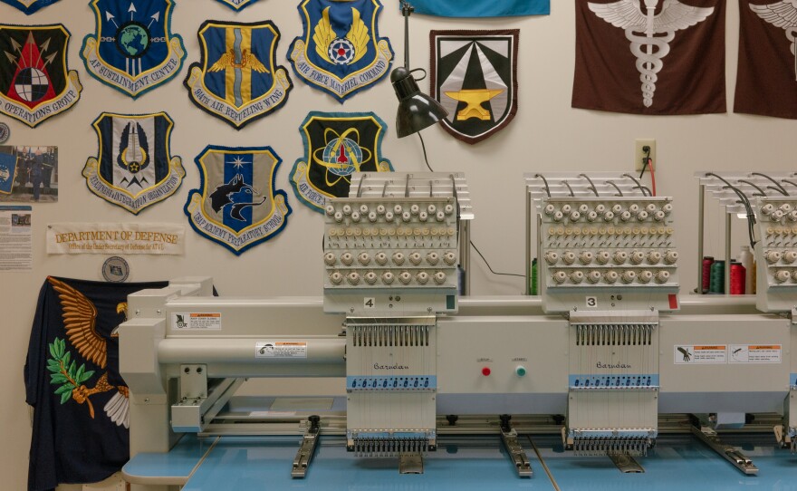 An embroidery machine at the Defense Logistics Agency Troop Support Flag Room.