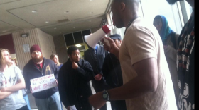 Mark Jones rallies protesters outside San Diego City Hall on Dec. 15, 2014. 