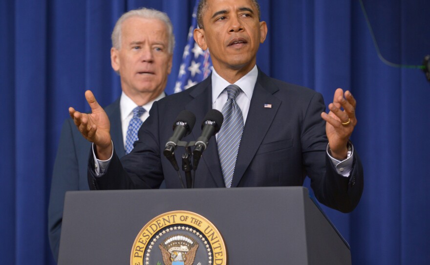 President Obama at the White House today, with Vice President Biden in the background.