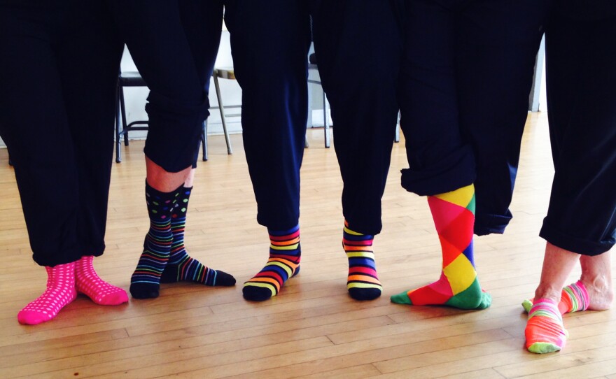 Dance students and teachers strike a pose at Invertigo Dance Theatre's class for people with Parkinson's.