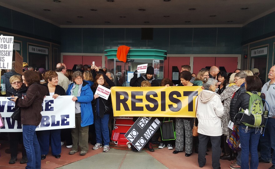 Protesters wait to get into a town hall meeting held by Rep. Tom McClintock (R-Calif.) in Roseville, Calif., on Saturday.