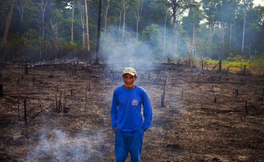 This caretaker of a small farm outside Porto Velho says he is burning his boss's land to make it better for the cattle.