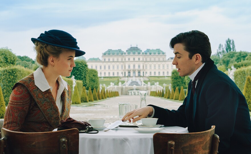 Clara and Max drink tea in Belevedere Palace Gardens. Max has a favour to ask. Actors left to right: Luise von Finckh and Matthew Beard