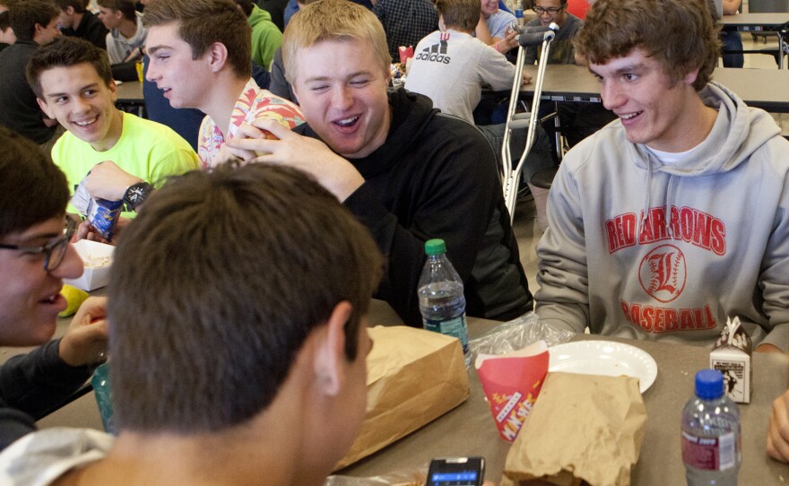 Students at Lowell High School in Michigan sit down for lunch. Shorter lunch breaks mean that many kids don't get enough time to eat and socialize.