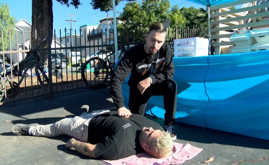Nathan Smiddy, known as 'Narcan Nate,' giving a training on Narcan administration on Brandon O'Connell in Oceanside, Calif. October 27, 2021.