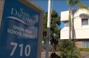 A sign outside of the San Dieguito Union High School District headquarters, April 21, 2022.