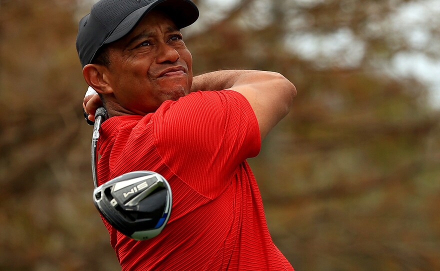 Tiger Woods, pictured in December 2020, posted a video on Sunday of himself practicing. He faced complex injuries sustained in a car crash in February.