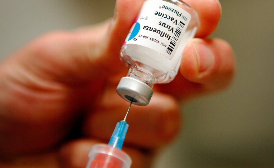 A nurse prepares an injection of the influenza vaccine at Massachusetts General Hospital in Boston, Mass., on January 10, 2013.
