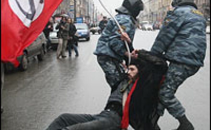 Riot policemen arrest a protestor in St. Petersburg, Russia, March 3, 2007. Scuffles broke out as about 5,000 people gathered to demonstrate against President Vladimir Putin's leadership ahead of forthcoming elections.