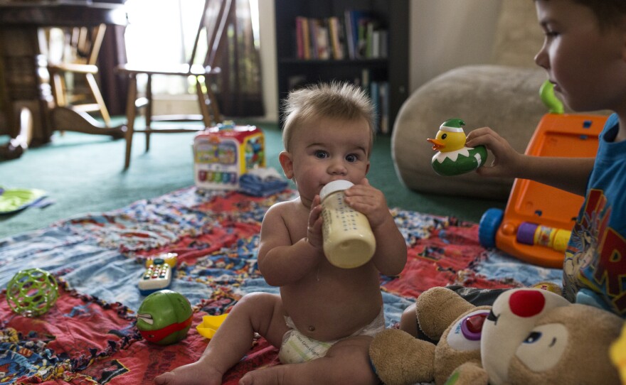 The 8-month-old son of Vicki and Alex Masters sits in the living room of the family's El Cajon home, where toxic vapors have seeped from underground pollution. July 18, 2017.