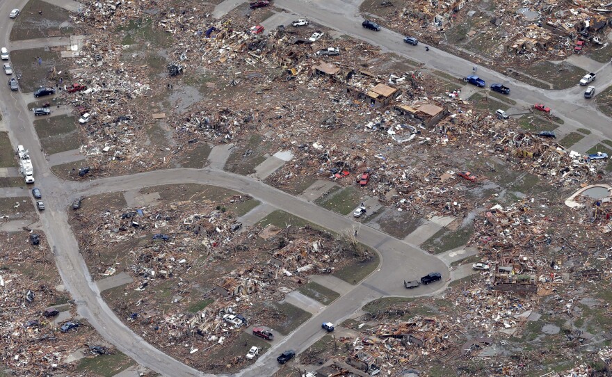 An aerial view shows an entire neighborhood destroyed by Monday's tornado in Moore, Okla.