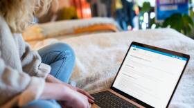 A woman looks at a laptop computer in this undated photo. 