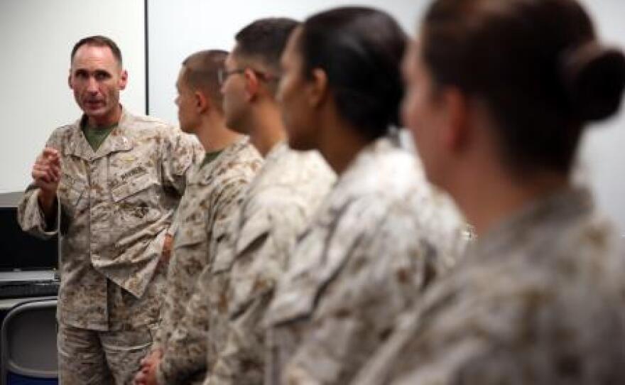 Col. Ernest L. Ackiss speaks to Marines on Cherry Point July 10 who recently earned Certified Logistics Associate and Certified Logistics Technician certificates.
