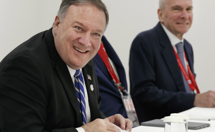 Secretary of State Mike Pompeo (left) sits down for a meeting in Osaka, Japan, on June 28. At right is Michael McKinley, Pompeo's de facto chief of staff. McKinley abruptly retired last week after a nearly four-decade career as an American diplomat.