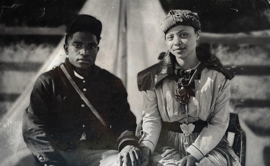 Actors Jordan Stafford (left) and Kynya Kirch (right) portray Samuel and Mary Truehart having their photograph taken at Camp Nelson, Ky.