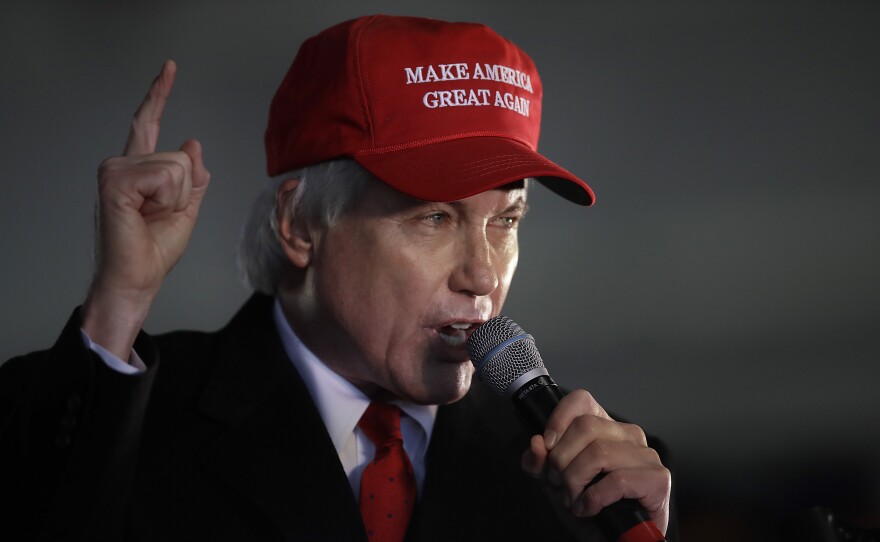 Attorney Lin Wood, who served as a member of former President Donald Trump's legal team, speaks during a rally in December 2020 in Alpharetta, Ga. He is among the lawyers who now have to defend their actions around the 2020 presidential election.