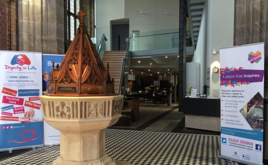 Beyond the entrance to All Souls Church in Bolton, England, are a small cafe, the original altar and pipe organ, gathering spaces for the community, and a touch-screen terminal that plays recorded recollections of the church's history.