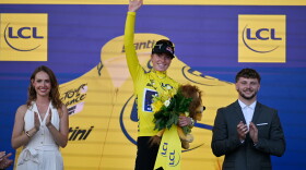 Netherlands' Demi Vollering celebrates on the podium after winning the Women's Tour de France cycling race in Nice, France, Sunday, Aug. 9, 2026.